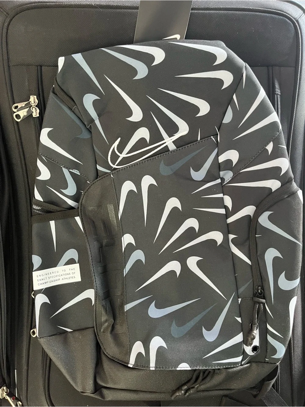 Nike Black Backpack with White and Gray Swoosh Pattern